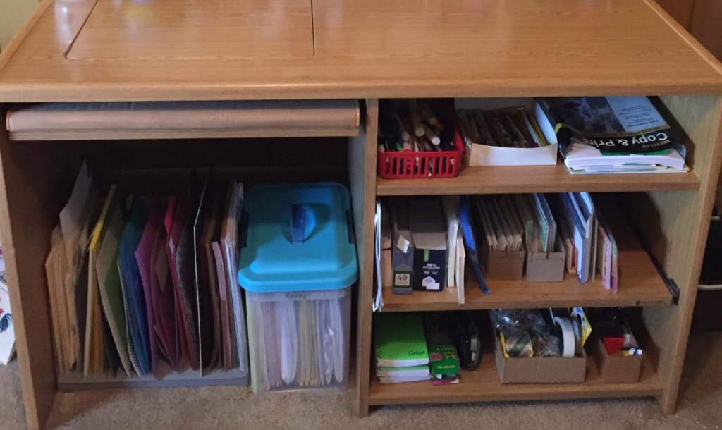 School desk with organized papers and containers.