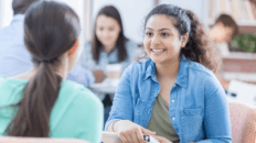 Students talking with each other.