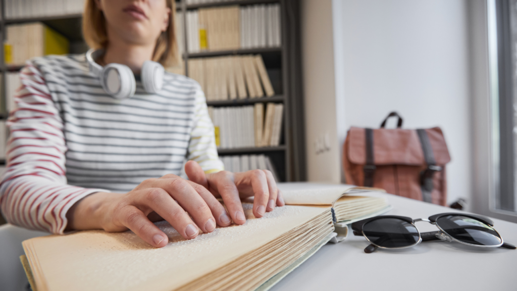 Student reading Braille