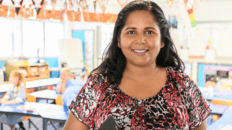 Teacher in a classroom image.