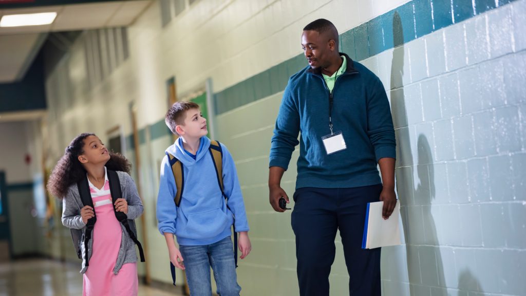 School principal with students