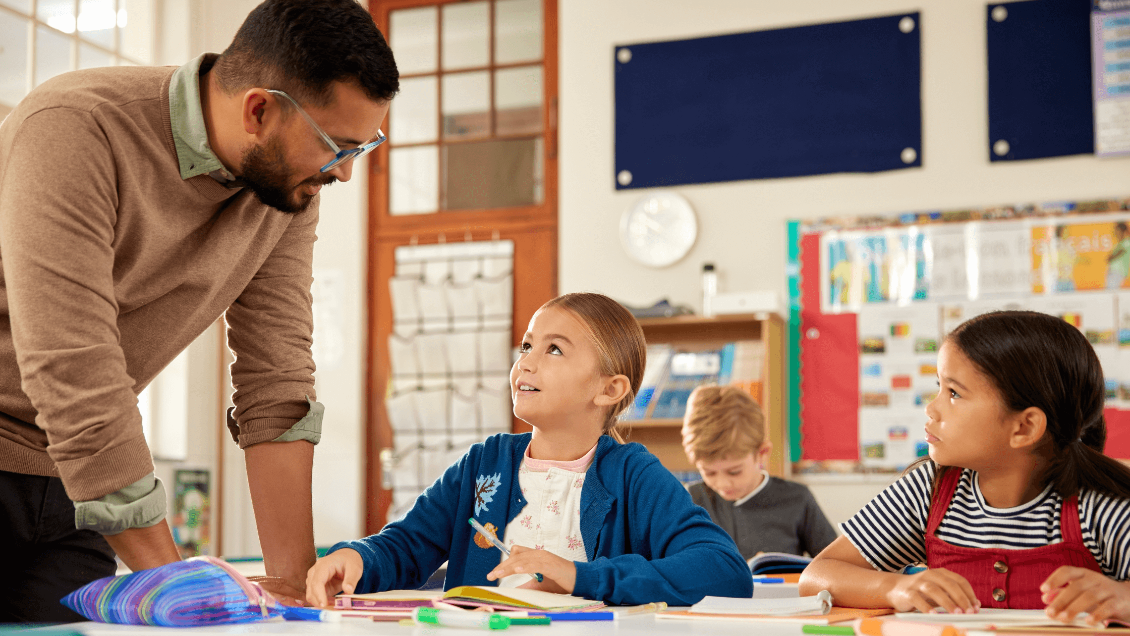 Teacher working with students