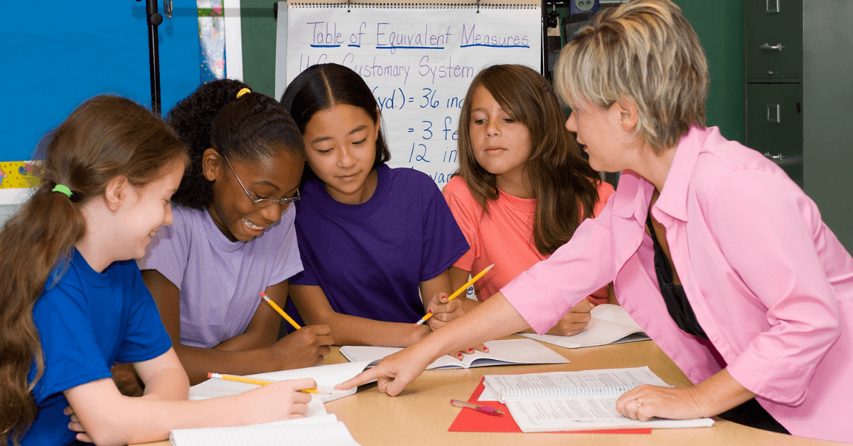 teacher working with small group of students