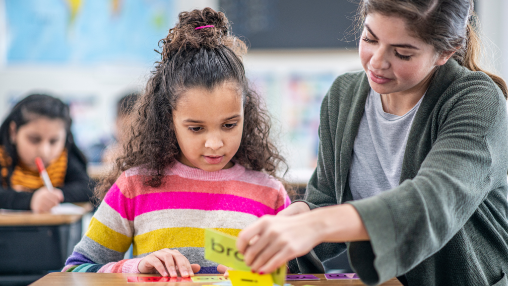 Teacher working with a student