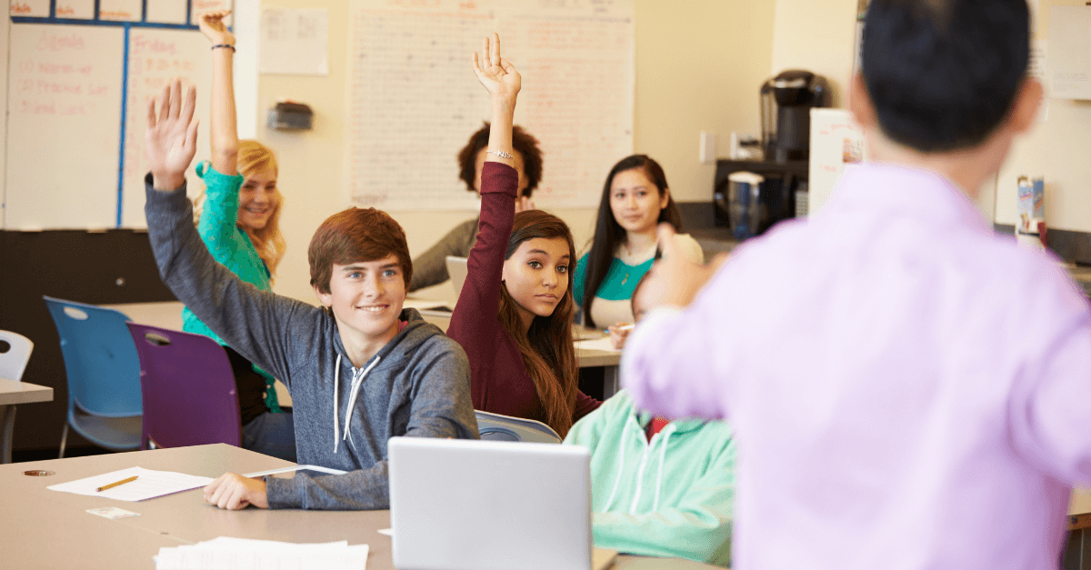 engaged students raising hands