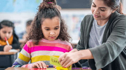 emergent bilingual student and paraprofessional